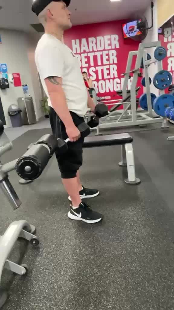 A gym session, working through a set with dumbbells